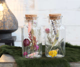Flacon en verre avec 2 fleurs séchées différentes Ø7cm (12 pièces)