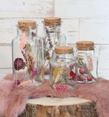 Flacon en verre avec 2 fleurs séchées différentes Ø7cm (12 pièces)