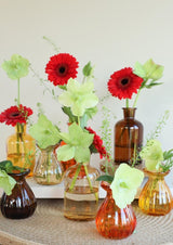 Bouteilles en verre Ø70 h: 90 mm couleurs assorties - 12 Pcs